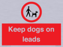 dogs-on-lead-symbol-with-black-text-on-white-background~